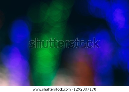Abstract blurred background. Defocused blue green lights.