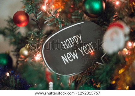 A happy new year, an inscription on a decorated Christmas tree