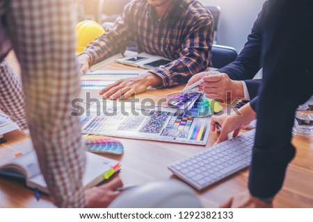 Team designer working graphic with color chart and meeting brainstorm for new project. Royalty-Free Stock Photo #1292382133