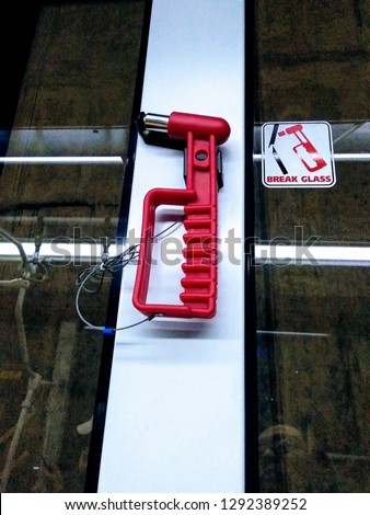 Window breaker is tied on bus window frame in case of emergency