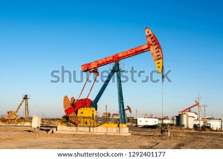 Oil pumps are in operation at the oil field