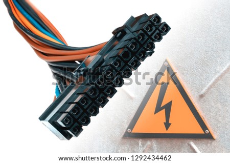 Cable from power supply for personal computer. Connectors are black. Electric multi-colored.