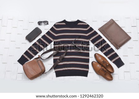Set of warm striped sweater with leather shoes, purse, watch,sunglasses,
