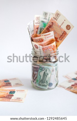 Save money concept. Russian money in jar.