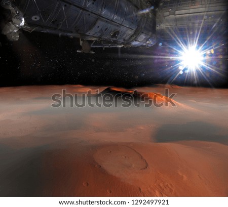 
Spaceship on the orbit above Mars surface on the background. Elements of this image furnished by NASA.