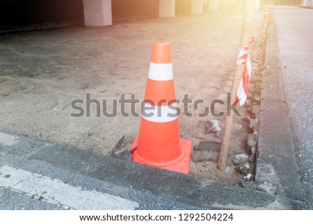 red safety cones and tape on blind floor in site construction and security zone.