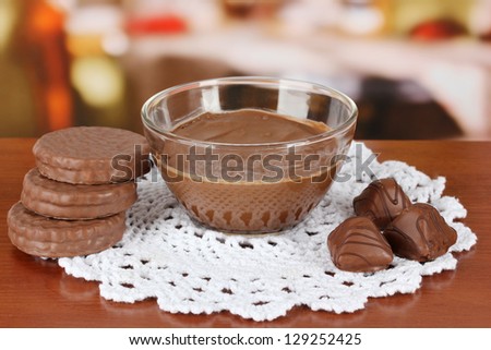 Bowl of chocolate and sweets on table in cafe