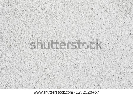 Background texture.White concrete wall. Small cracks on the surface.