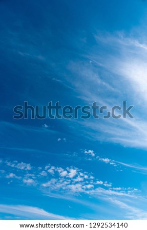 Vertical image of blue sky and white cloud on day time for background usage.
