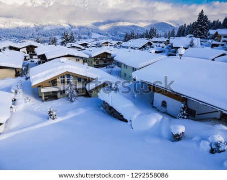 Snow covered village in Austria during winter after heavy snowing. Ellmau