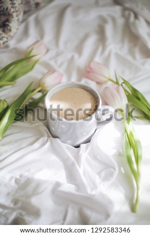 breakfast in bed, coffee and tulips in a white bed, good morning for mom, good morning for the woman you love, morning March 8