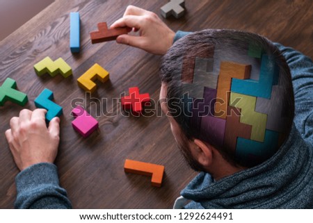 The concept of the human brain. Education, science and medical concept.  Brain drawn in chalk on black cubes. Royalty-Free Stock Photo #1292624491