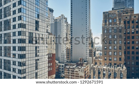 Manhattan cityscape, cinematic color toning applied, New York City, USA.