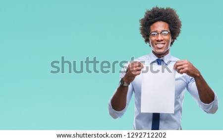 Afro american man holding blank paper contract over isolated background with a happy face standing and smiling with a confident smile showing teeth
