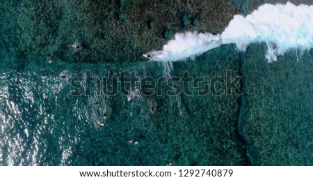 surfing in aerial view, teahupoo papeete french polynesia
