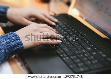 woman using laptop, searching web, browsing information, having workplace at home / soft focus picture 