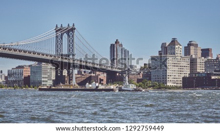 Panoramic view of the Manhattan Bridge and Brooklyn, color toned picture, New York, USA.