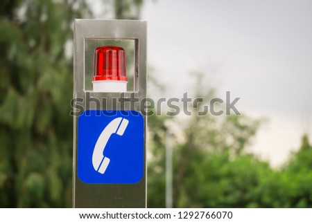 Emergency pole with help call box located in public park Thailand.