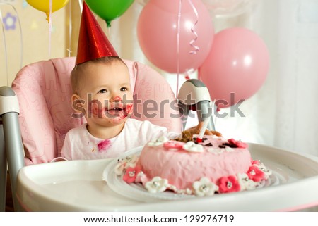 one-year-old little girl solemnize birthday, happy laughter, horizontal photo