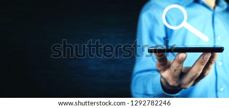Man holding smartphone. Concept of research