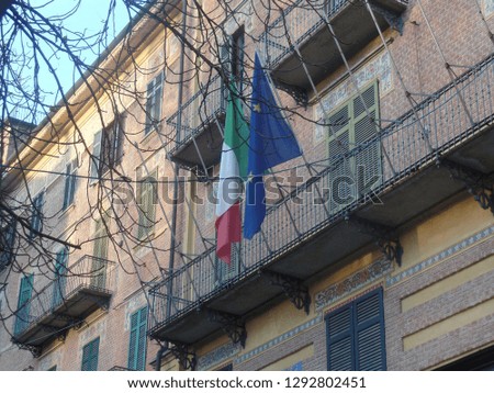 Italian and EU flags flying side by side