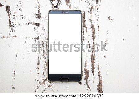 Mock up smart phone on white wooden background.
