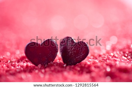 Pink bokeh background and two hearts