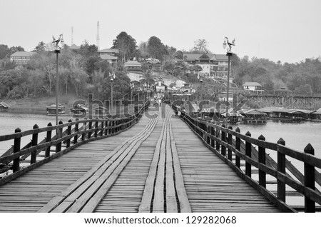 Black and white Mon bridge, across river , songkalia river, Sangkhlaburi Kanchanaburi, Thailand