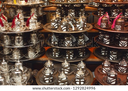 Traditional handmade tea and coffee sets for sale at the Egyptian Bazaar and the Grand Bazaar in Istanbul, Turkey. Outdoor shot