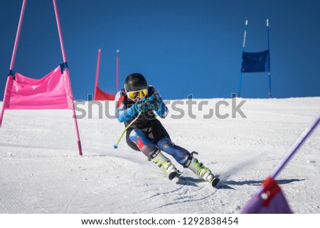 athlete in alpine skiing competition Royalty-Free Stock Photo #1292838454