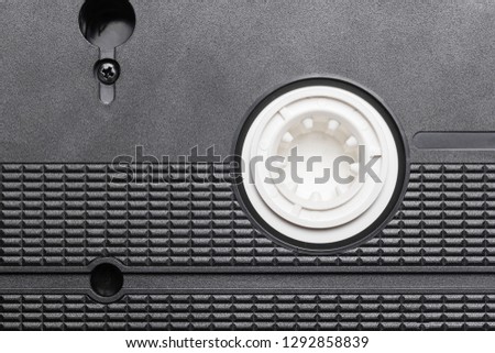 Black vhs tape isolated on white. Outdated technology background.