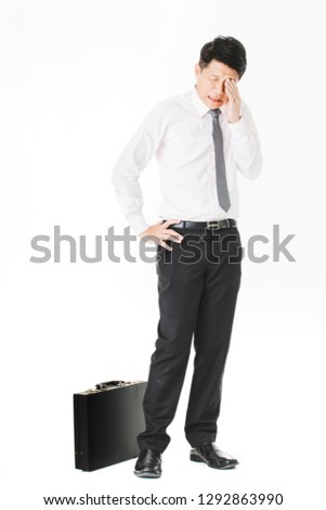 Full length portrait of middle aged, handsome, Asian, businessman, in white shirt, striped tie
black pants and shoes, holding briefcase, worm greeting his friend, on isolated white background