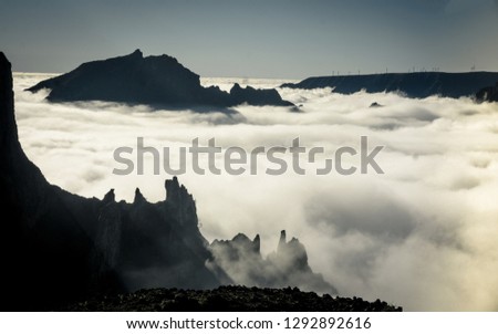 
Photographer looks into the landscape and listen the silence. Man prepare camera to takes impressive photos of misty fall mountains.