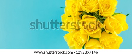 Creative top view flat lay fresh yellow roses bouquet with copy space bold color paper background minimalism style. Template feminine blog social media holiday wedding invitation card