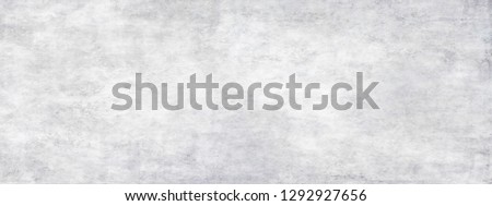 Long wide white light panoramic wallpaper. Monochrome texture background with white and gray color.Grunge old wall texture, concrete cement