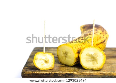 Organic bananas with freckles TNF (Tumor Necrosis Factor) on fruit peels isolated on a white backgroundd