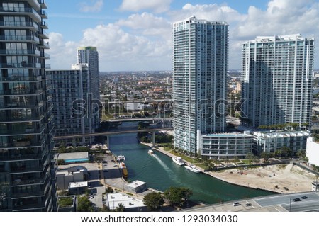 The beautiful city of Miami and Brickell area. Buildings surrounded by water, rivers and sea life inside the city.