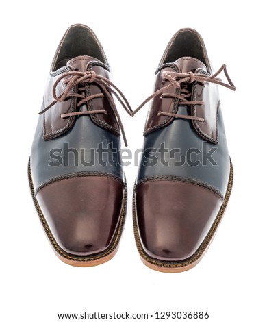 A pair of derby navy multi cap toe dress shoes on an isolated background