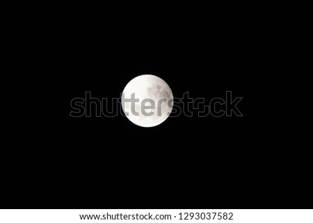 The famous full moon at night, an astronomical body that orbits planet earth and is earth's only permanent natural satellite.