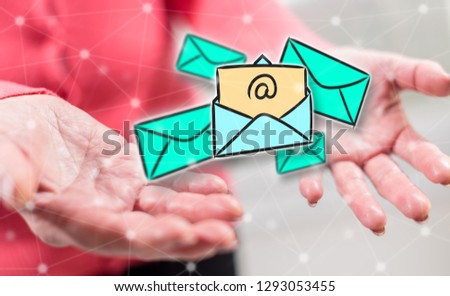 E-mail concept above the hands of a woman in background