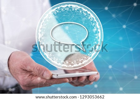Global communication concept above a smartphone held by hands
