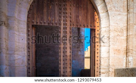 A beautiful photo of the popular Torres de Quart o Puerta de Quart, which is a medieval gothic gate  located in the Guillen de Castro and Quart streets, in the city of Valencia, in Spain, Europe.