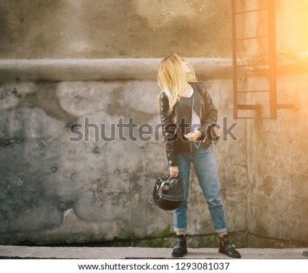 young woman posing in old town