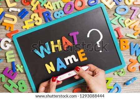 Hard to choose or decide the name of new born baby, with “what name“ question on blackboard and woman’s hand holding positive pregnancy test
 Royalty-Free Stock Photo #1293088444