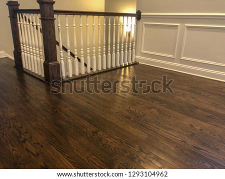 Beautiful hardwood floor made of the dark natural cherry wood in brown color, dark grains and linear pattern, worm home interior look