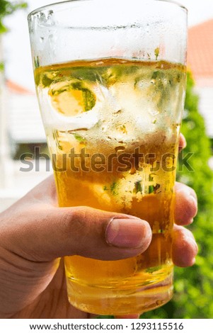 Glass drinks in hand