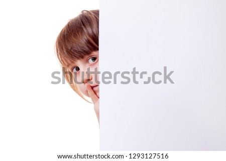 Beautiful child girl showing blank white board for advertising to be inserted