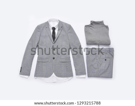 Flat lay stripy suit with tie and white shirt ,sweater close up


