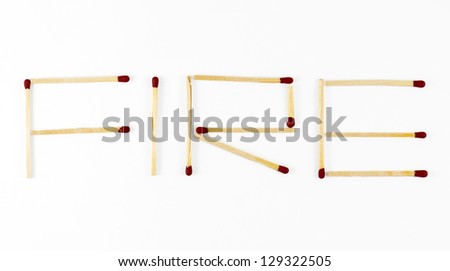 Word Fire made of matchsticks isolated on white background.