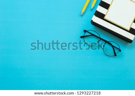 mockup image.office equipment on desk table.blank blue background empty copy space for text design studio creativity ideas for study,education,business modern accessories at workplace.blogging,blog 